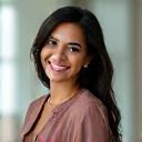 Portrait of Fatima H, a driven charity executive.